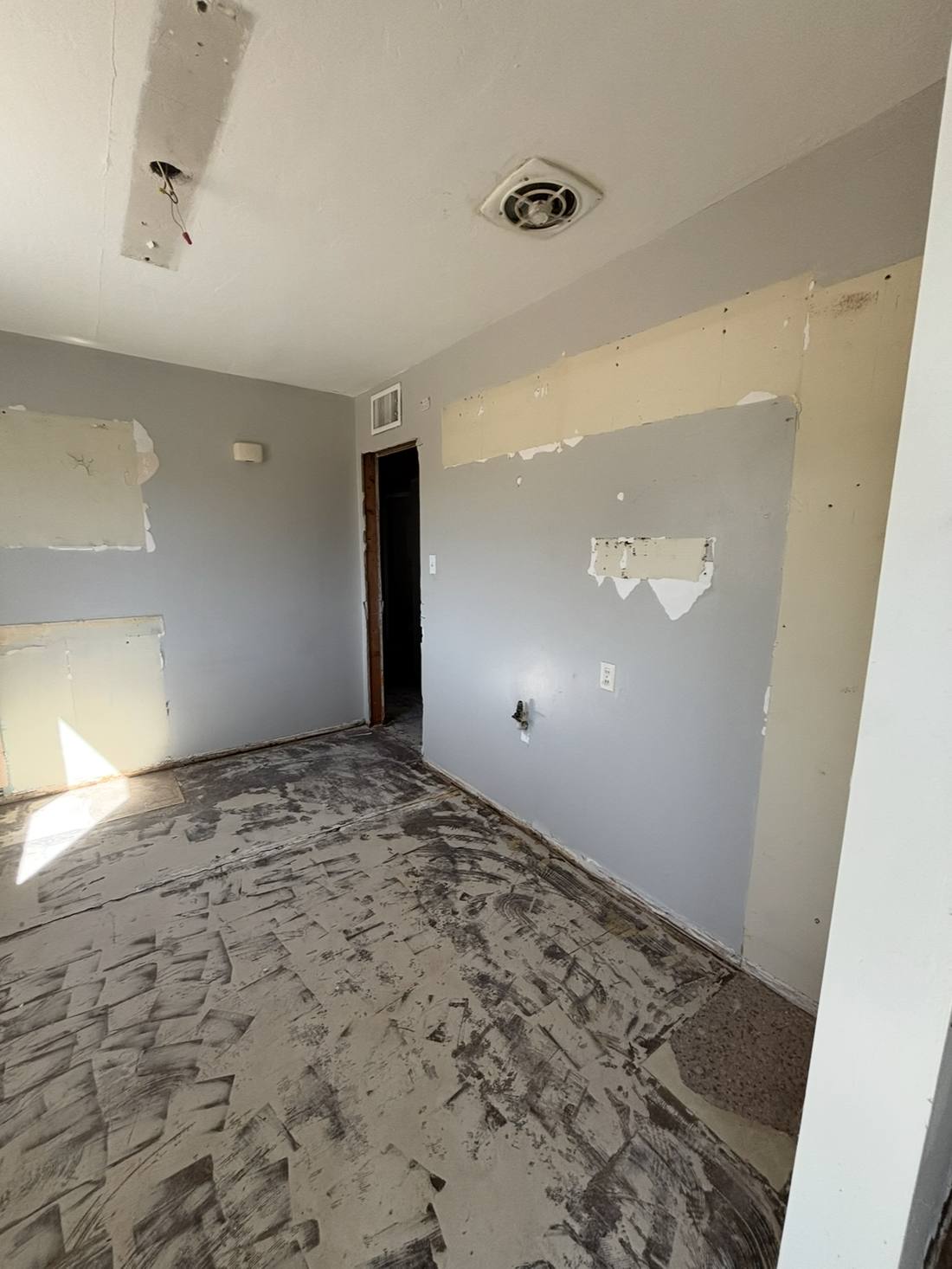 Room stripped to subfloor during demolition